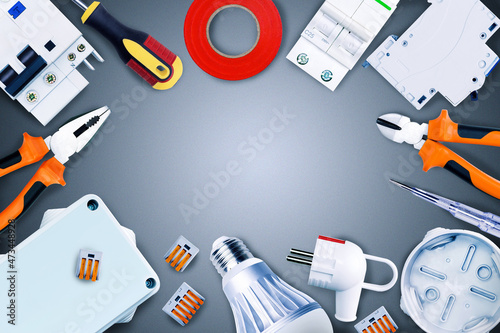 Electrical tools and equipment on grey background with copy space. Top view.
