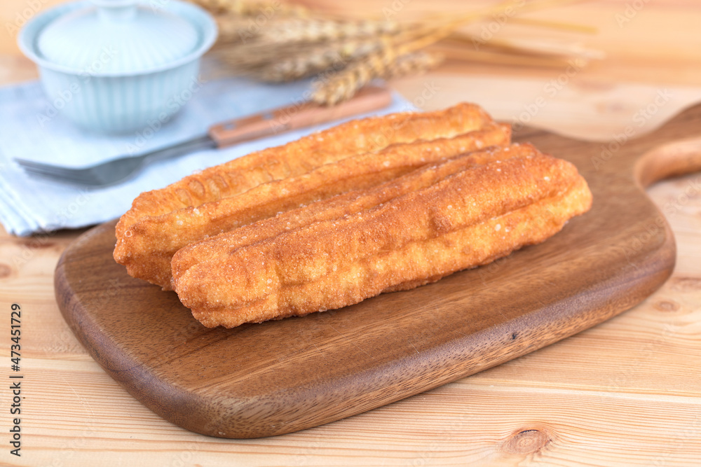 Chinese traditional breakfast fried dough sticks with tureen tea Chinese traditional breakfast fried dough sticks with tureen tea