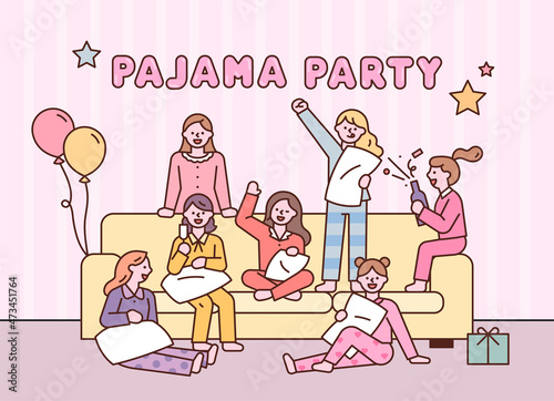 Cute little girls are having a pajama party while sitting around the sofa. flat design style vector illustration.