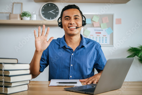 man with headphones working in office