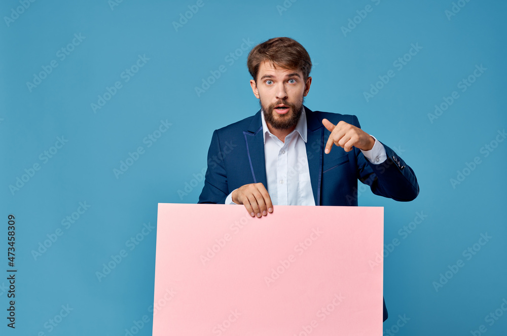 emotional man pink banner in hand blank sheet presentation isolated background emotional man pink banner in hand blank sheet presentation isolated background