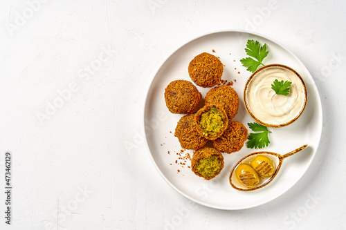 Chickpeas falafel with tahini sauce. Top view, copy space
