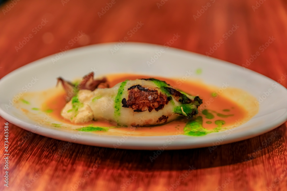 Obraz premium Spanish pintxos of grilled squid stuffed with crabmeat in San Sebastian, Spain