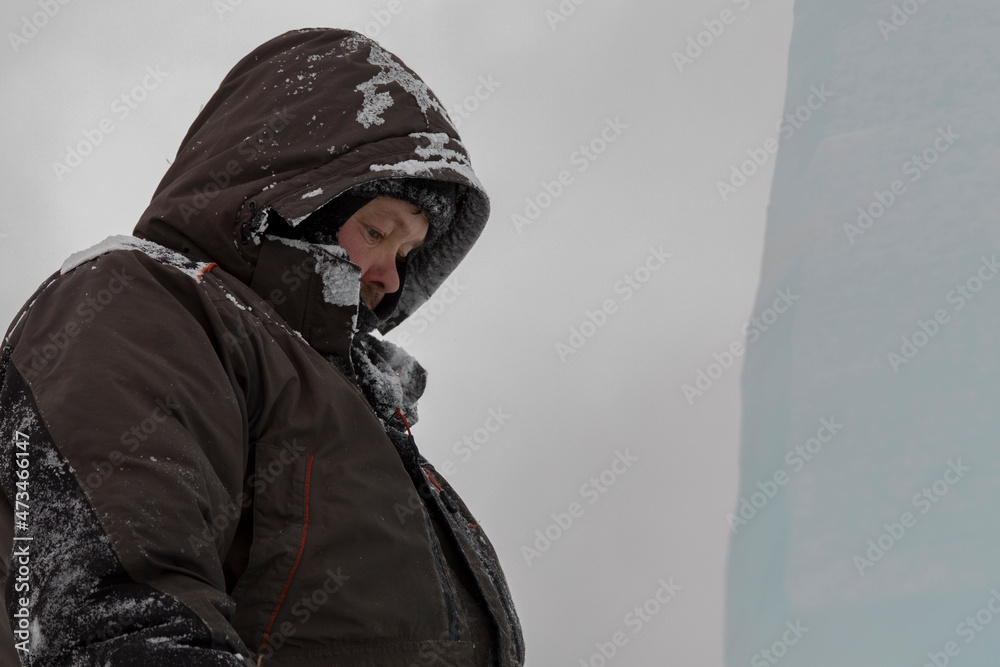 A portrait of a fitter with a hood on his head A portrait of a fitter with a hood on his head