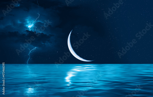 Ramadan Kareem background - Crescent moon, stars above serene sea with lightning