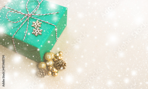Eco friendly Christmas composition with gift boxes in craft reusable paper and natural decor on paper background top view. Zero waste environmentally friendly Christmas concept. Long banner format.