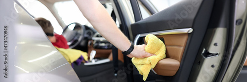 Car interior and door handles cleaning closeup photo