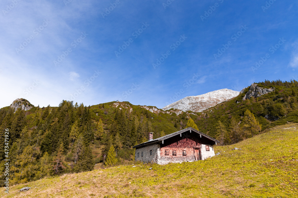 Alpine cabin in front of Hoher Göll in Berchtesgadener Land, Bavaria, Germany, in autumn.