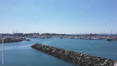 Flying over a marina filled with yachts