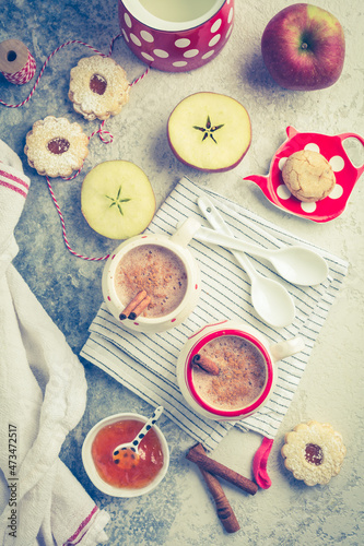 Winter hot drink. Hot chocolate or cocoa with spices, cookies and fresh apple