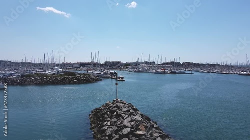 Flying over the yacht marina on a bright sunny day