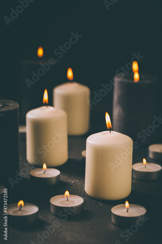 Candle flames glowing in the dark, spiritual atmosphere, religion and Christmas