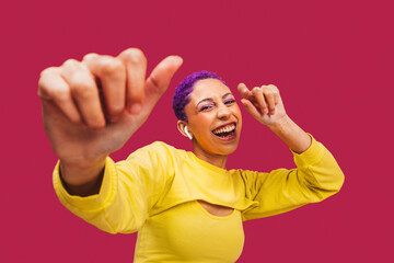 Young woman dancing to her favourite song