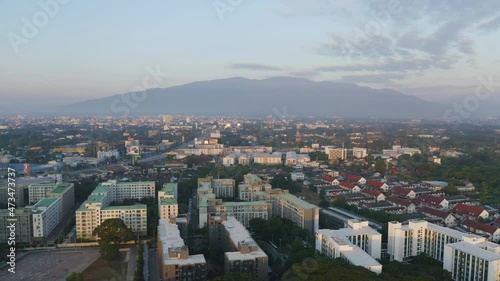 Aerial view of Chiang Mai Downtown Skyline, Thailand. Financial district and business centers in smart urban city in Asia. Skyscraper and high-rise buildings at sunset. photo