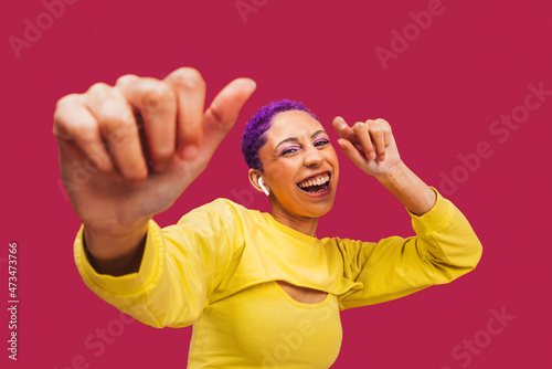 Young woman dancing to her favourite song photo