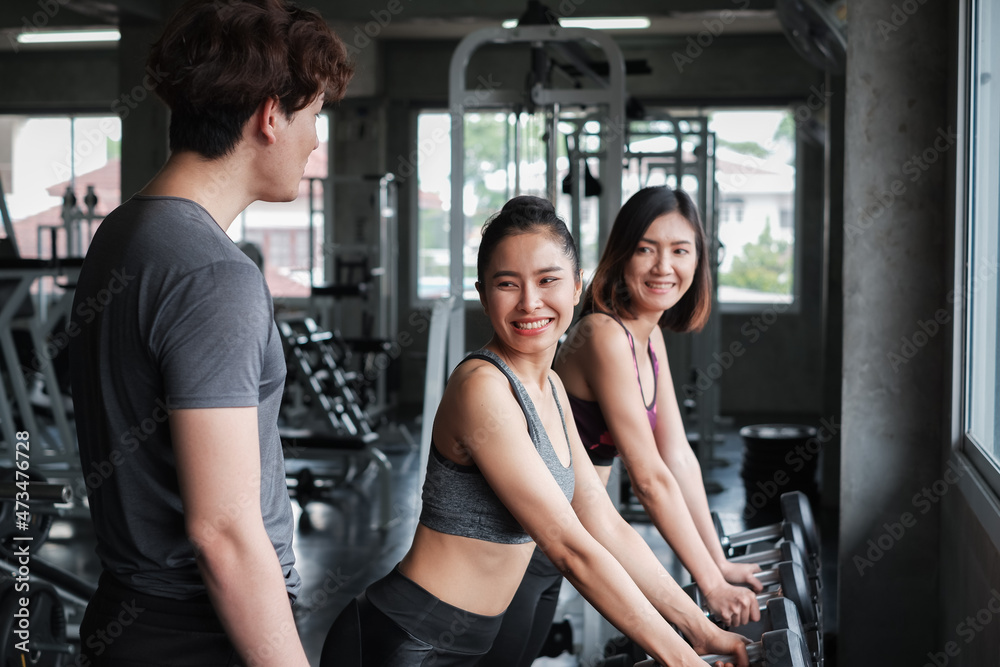 asia group friends working out or exercise and wearing sportswear in fitness or gym center, strength sporty and weight loss concept asia group friends working out or exercise and wearing sportswear in fitness or gym center, strength sporty and weight loss concept