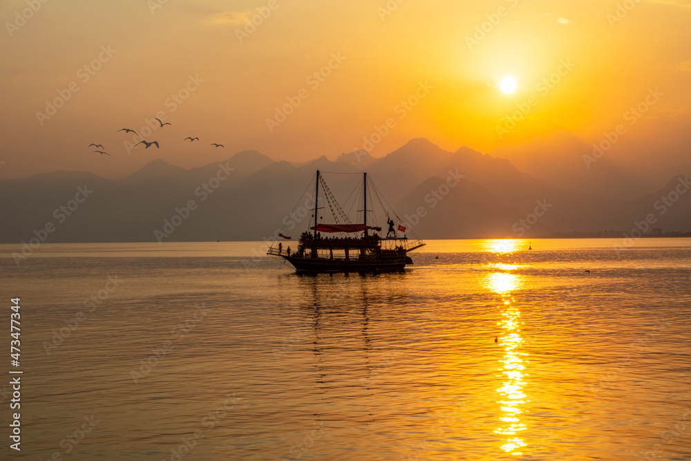 Antalya harbor over sunset sky and high mountains. Beautiful view of the Antalya Kaleiçi Old town (Kaleici) Antalya harbor over sunset sky and high mountains. Beautiful view of the Antalya Kaleiçi Old town (Kaleici)