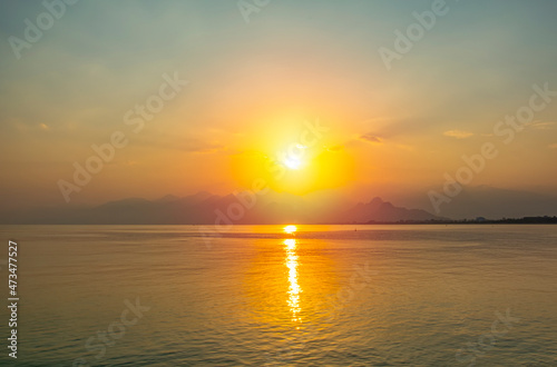 Antalya harbor over sunset sky and high mountains. Beautiful view of the Antalya Kaleiçi Old town (Kaleici)