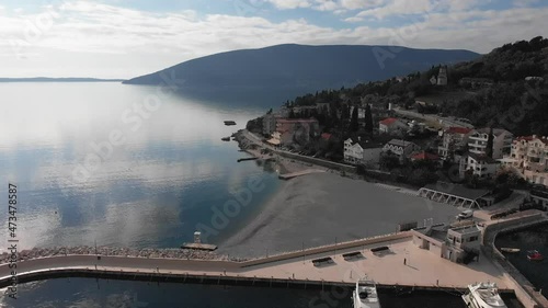 Flight along the city of Herceg Novi, beautiful sea and clouds