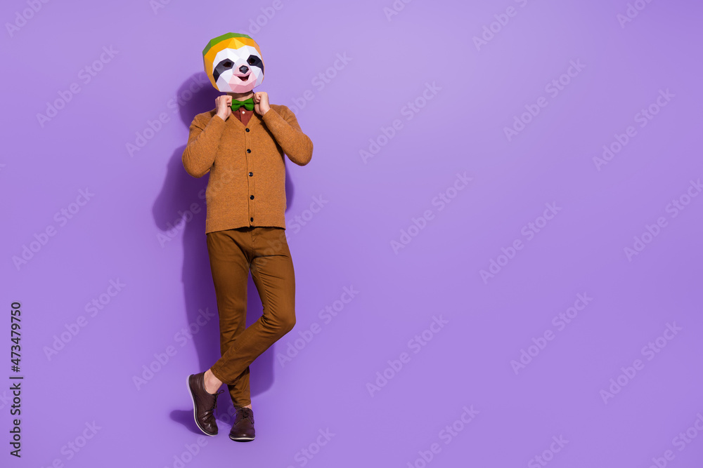 Full size photo of lazy slow mammal mask guy hands fixing bow isolated on purple color background