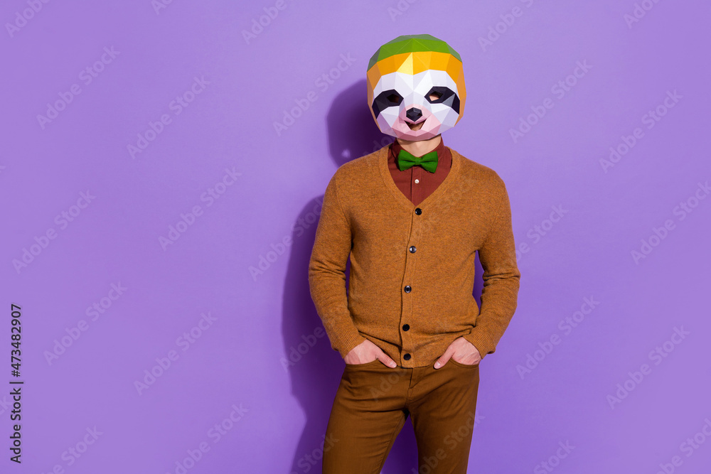 Photo of young man arms in pocket wear casual clothes halloween isolated over purple color background Photo of young man arms in pocket wear casual clothes halloween isolated over purple color background