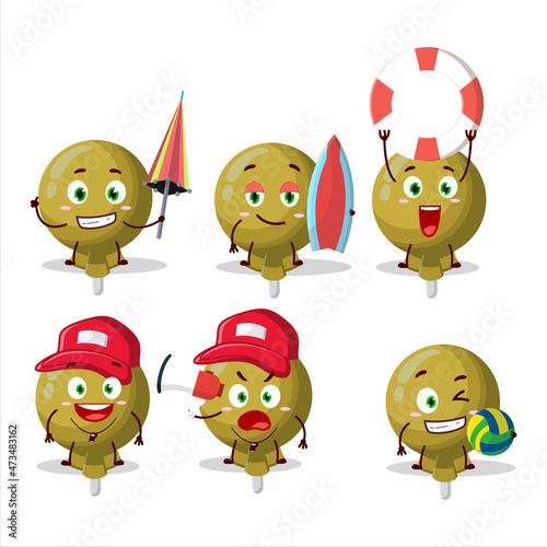 Happy Face yellow lolipop wrapped cartoon character playing on a beach