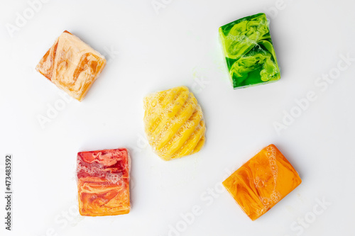 Colorful handmade soap bars on a white background