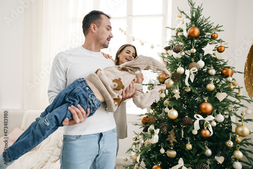 Obraz na plátně Happy family making Christmas decorations at home together