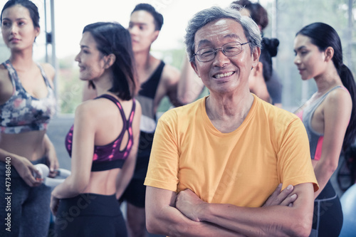 Senior man and young group people  Friends different ages in gym working out