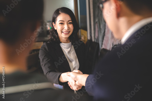 business people are shaking...