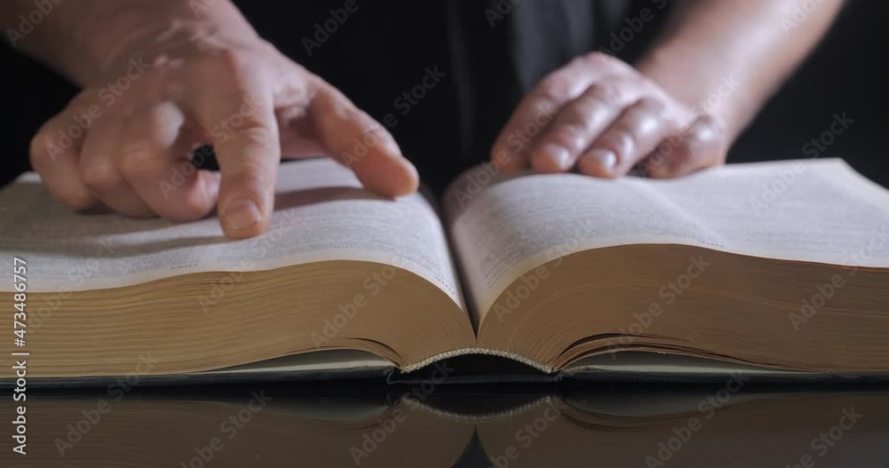 The man turns the pages of the textbook The man turns the pages of the textbook