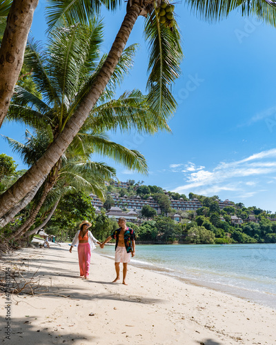 couple on the beach of Phuket in Siray Bay, man and woman on tropical beach. Asia  photo