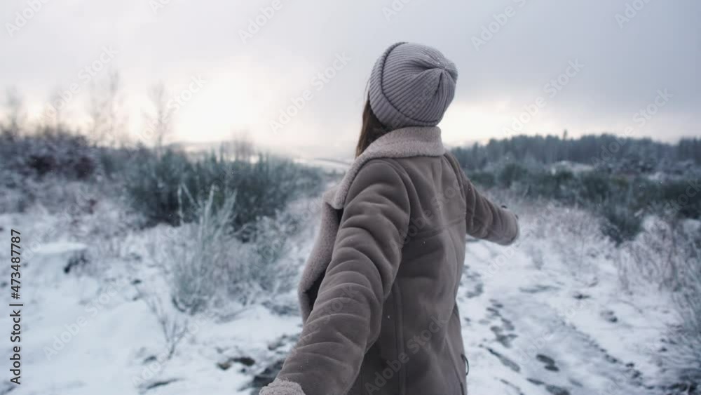 jung beautiful woman walking happily through snowy forest by snowfall jung beautiful woman walking happily through snowy forest by snowfall