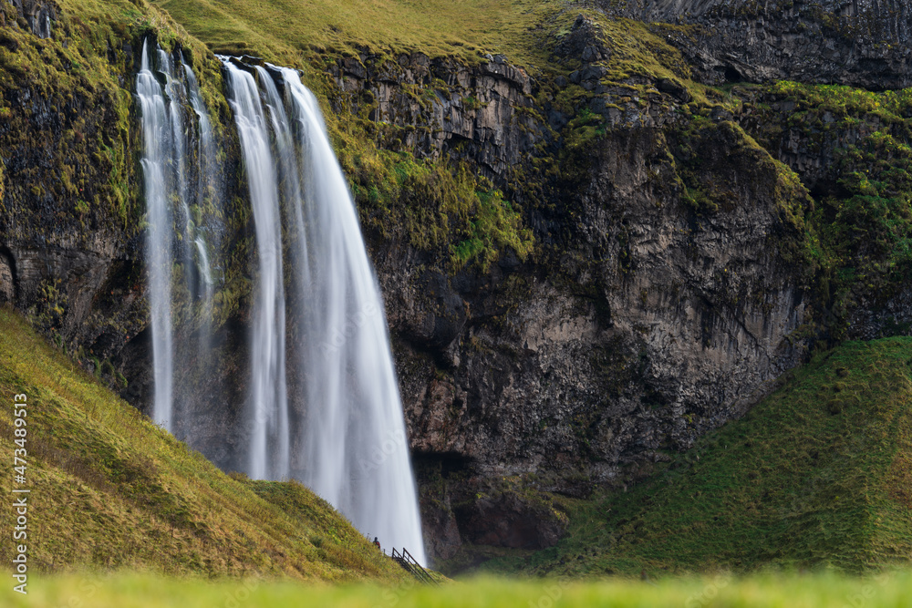 Seljalandfoss Waterfall in Iceland long exposure with tourist