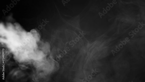 white smoke on a black background. Slow motion. Vape smoke