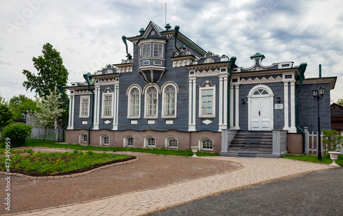 Facade of the wooden house of the Decembrist Sergei Trubetskoy 1854-56 in Irkutsk in summer in cloudy weather. photo