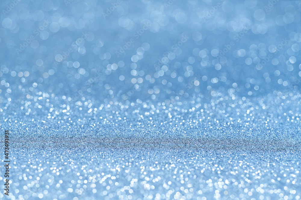 Obraz premium Blue glitter Christmas abstract background, with copy space for text.