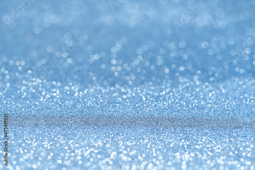 Blue glitter Christmas abstract background, with copy space for text.