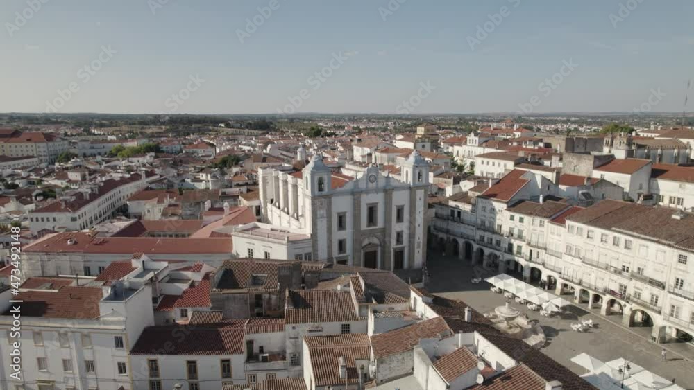 Flying towards Santo Antao Church at Giraldo square, Evora city centre, Alentejo Flying towards Santo Antao Church at Giraldo square, Evora city centre, Alentejo
