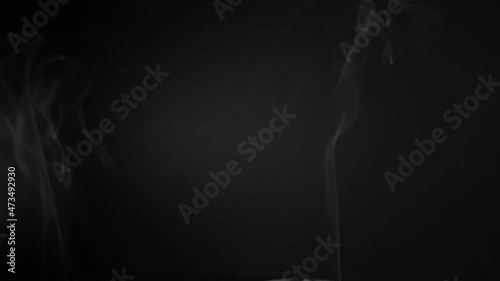 white smoke on a black background. Slow motion. Vape smoke