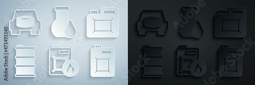 Set Canister for motor oil, Barrel, Oil petrol test tube and Spare wheel in the car icon. Vector