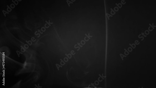 white smoke on a black background. Slow motion. Vape smoke