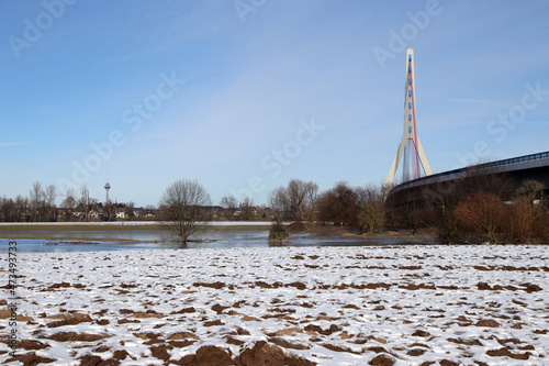 wintertag am rhein mit fleher brücke und rheinturm photo