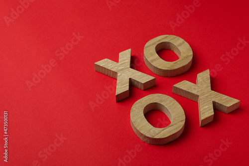 Valentine's Day concept with XO letters on red background photo