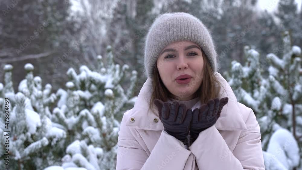 Young attractive girl smiling in the winter in the forest. Slowmo Young attractive girl smiling in the winter in the forest. Slowmo