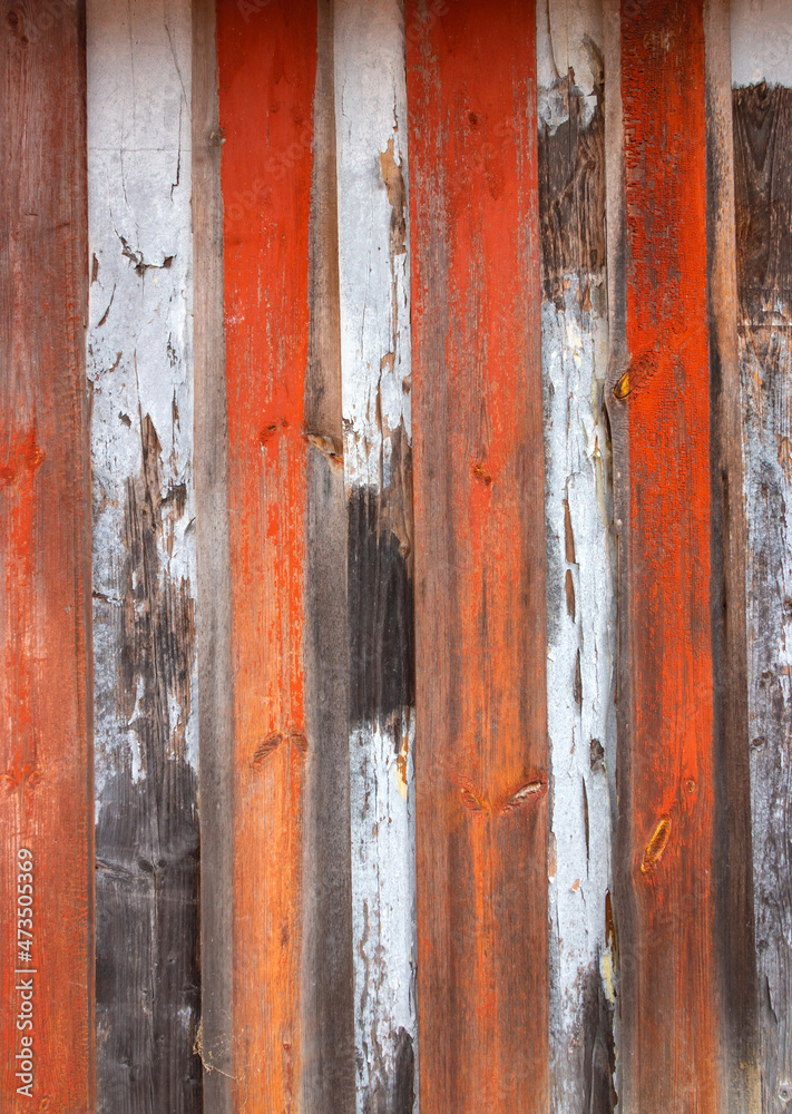 Old grey and brown wooden background with cracks and scratches in vintage style