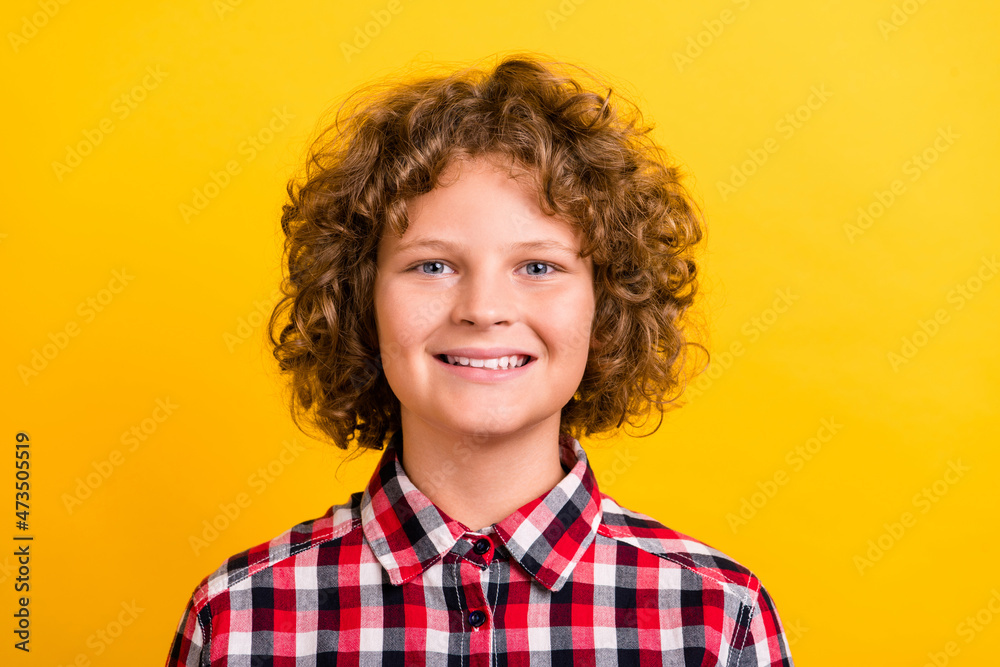 Photo of cool red hairdo small boy wear plaid shirt isolated on yellow color background Photo of cool red hairdo small boy wear plaid shirt isolated on yellow color background