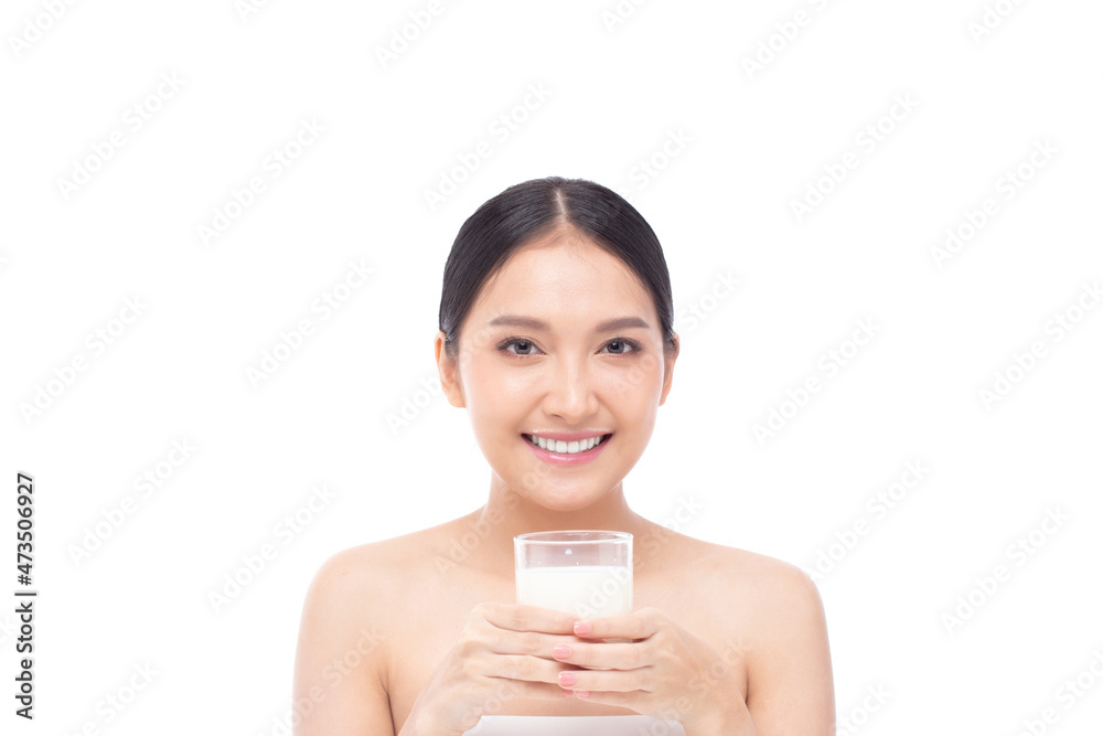Portrait of a beautiful young Asian woman drinking milk from the glass isolated on white background in studio shot, beauty shot. Portrait of a beautiful young Asian woman drinking milk from the glass isolated on white background in studio shot, beauty shot.