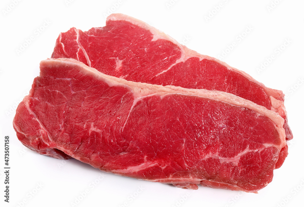 Two Raw Striploin Beef Steaks isolated on white Background 
