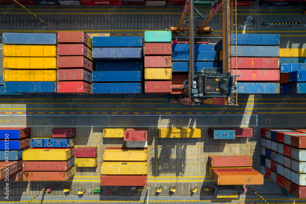 Port of Gdynia. Seaport, containers, container ships and sea transport from the bird's eye view on a sunny day.